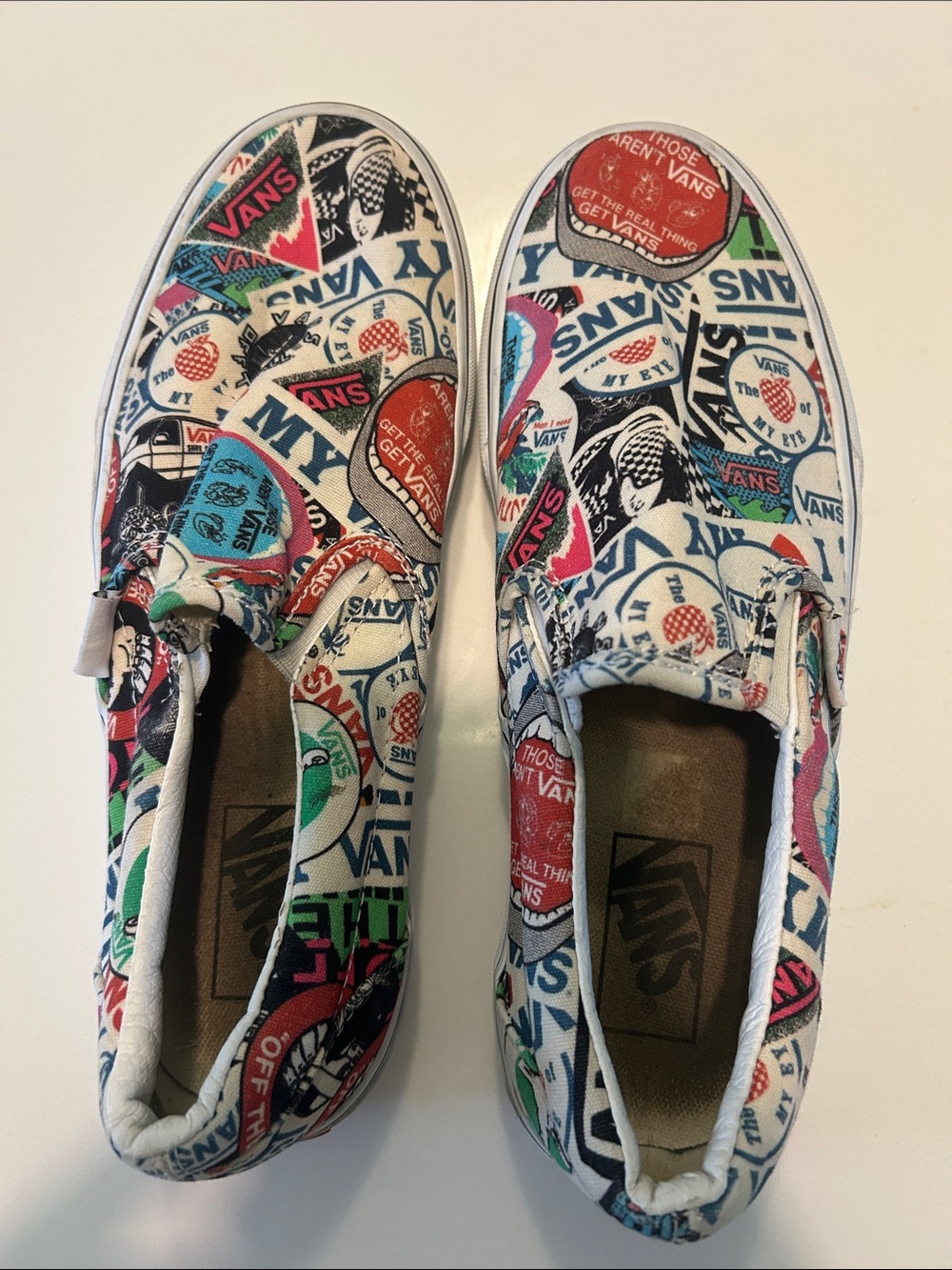 Vans Slip-On Sneakers in White with Multi-Color Sticker Print
